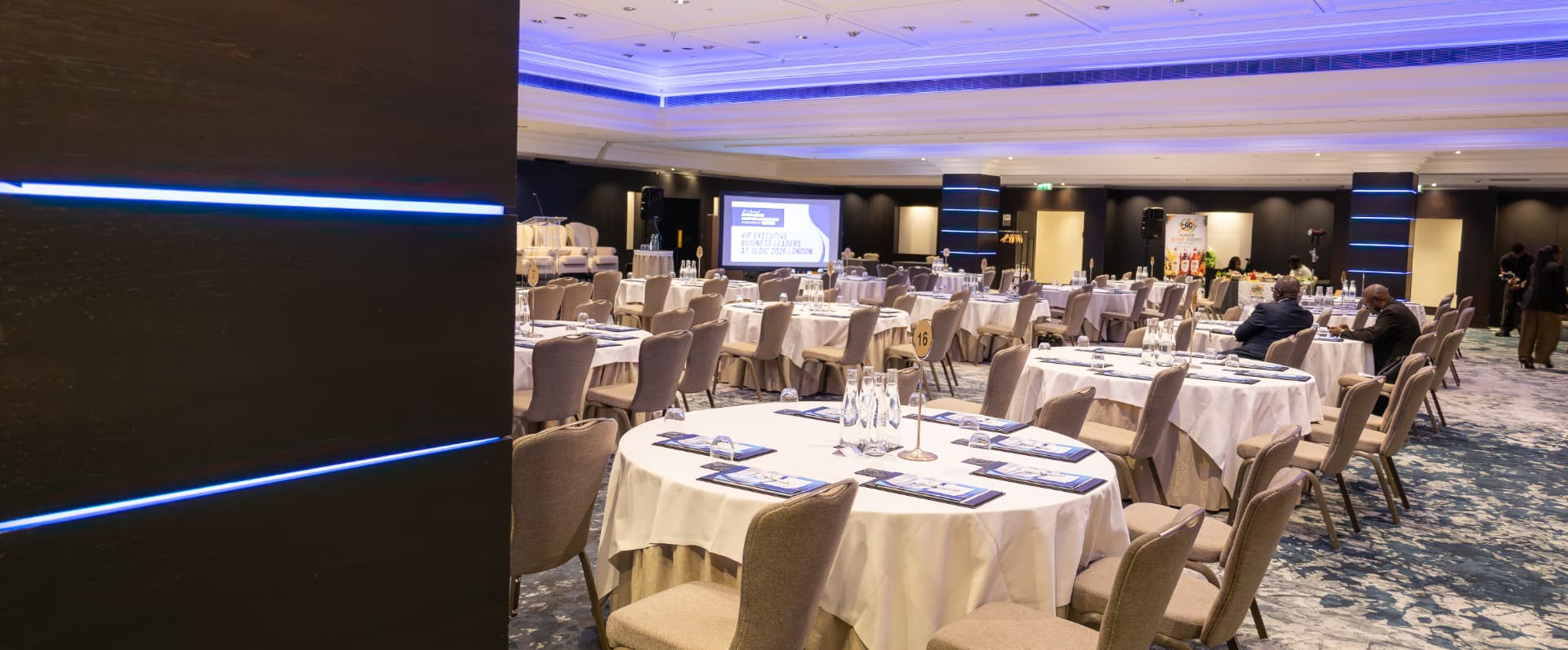 The conference ballroom dressed with round tables and programme books ahead of the opening session