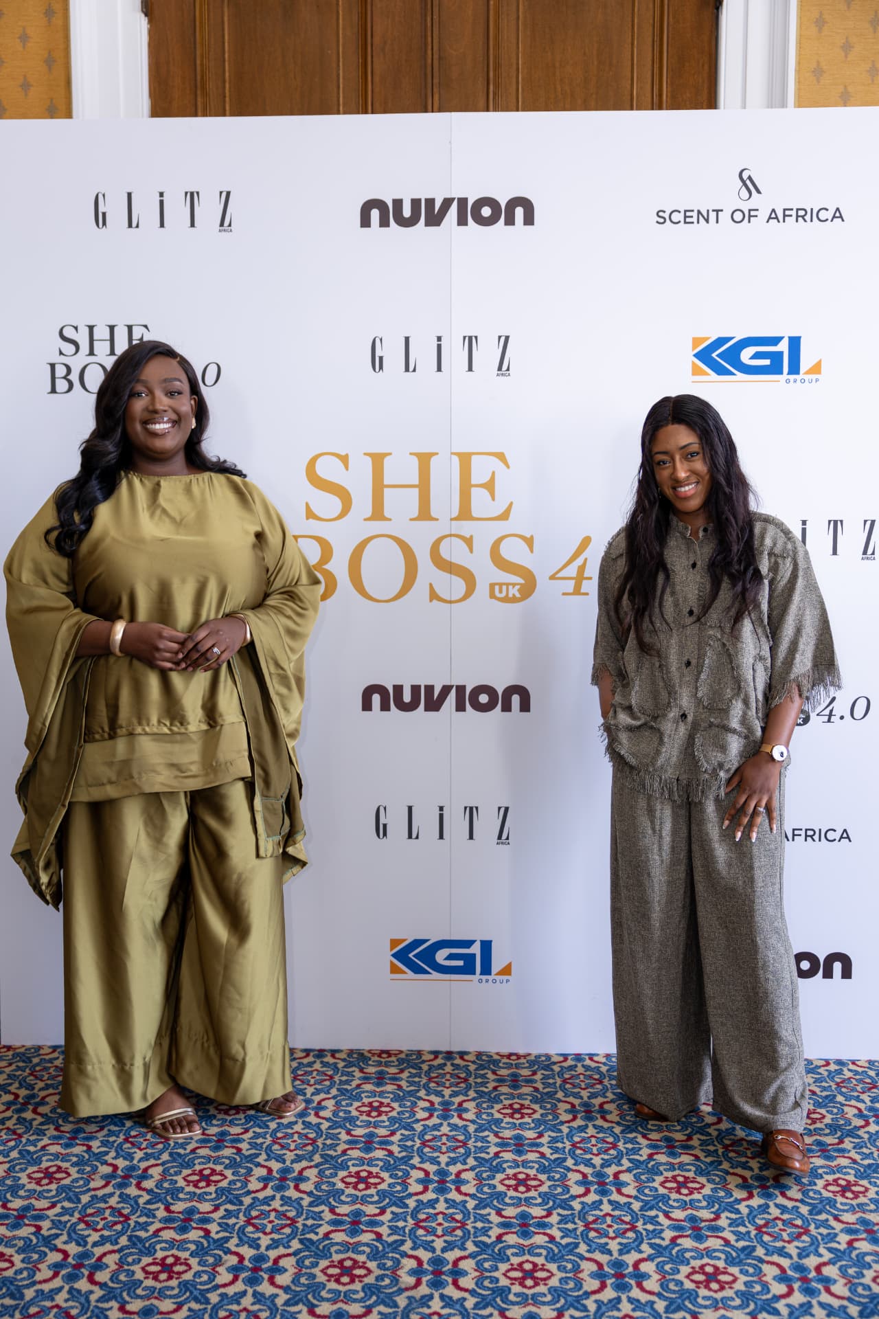 Partners and speakers at the step and repeat.