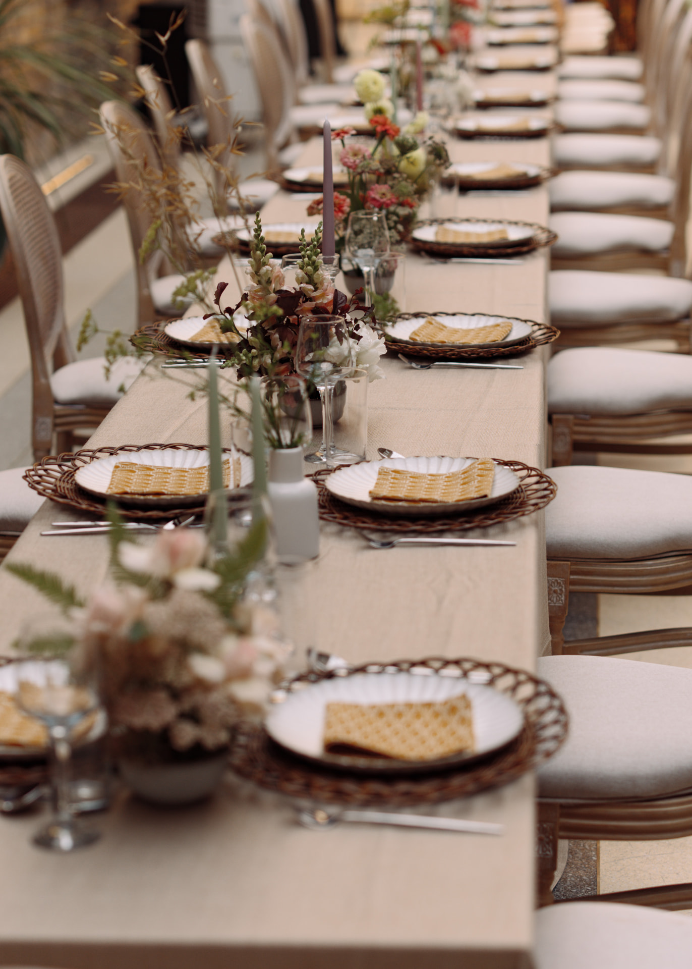 Long communal table set for an intimate multicultural wedding