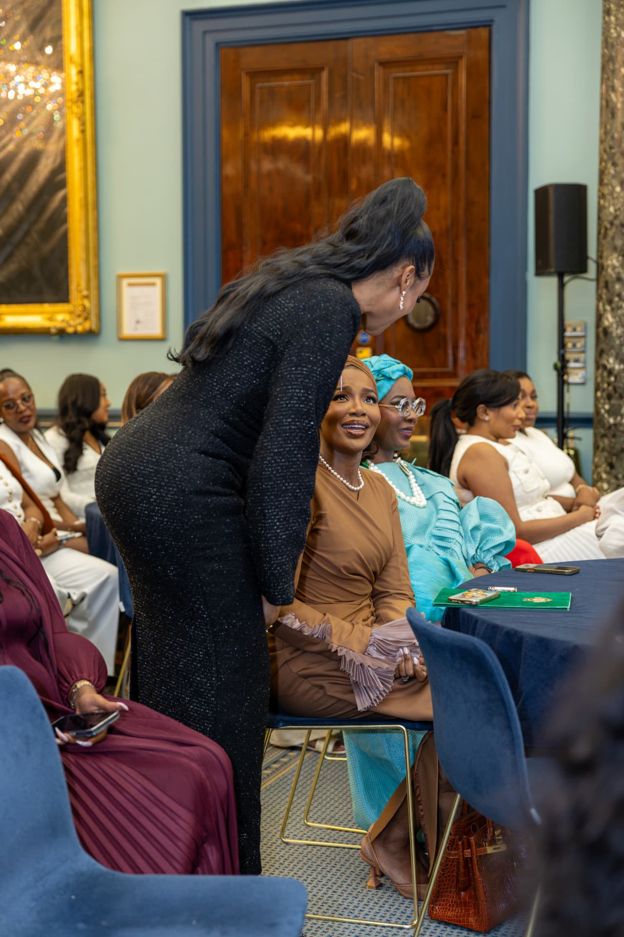 The founder greeting a delegate at the She Boss 2026 leadership symposium in London
